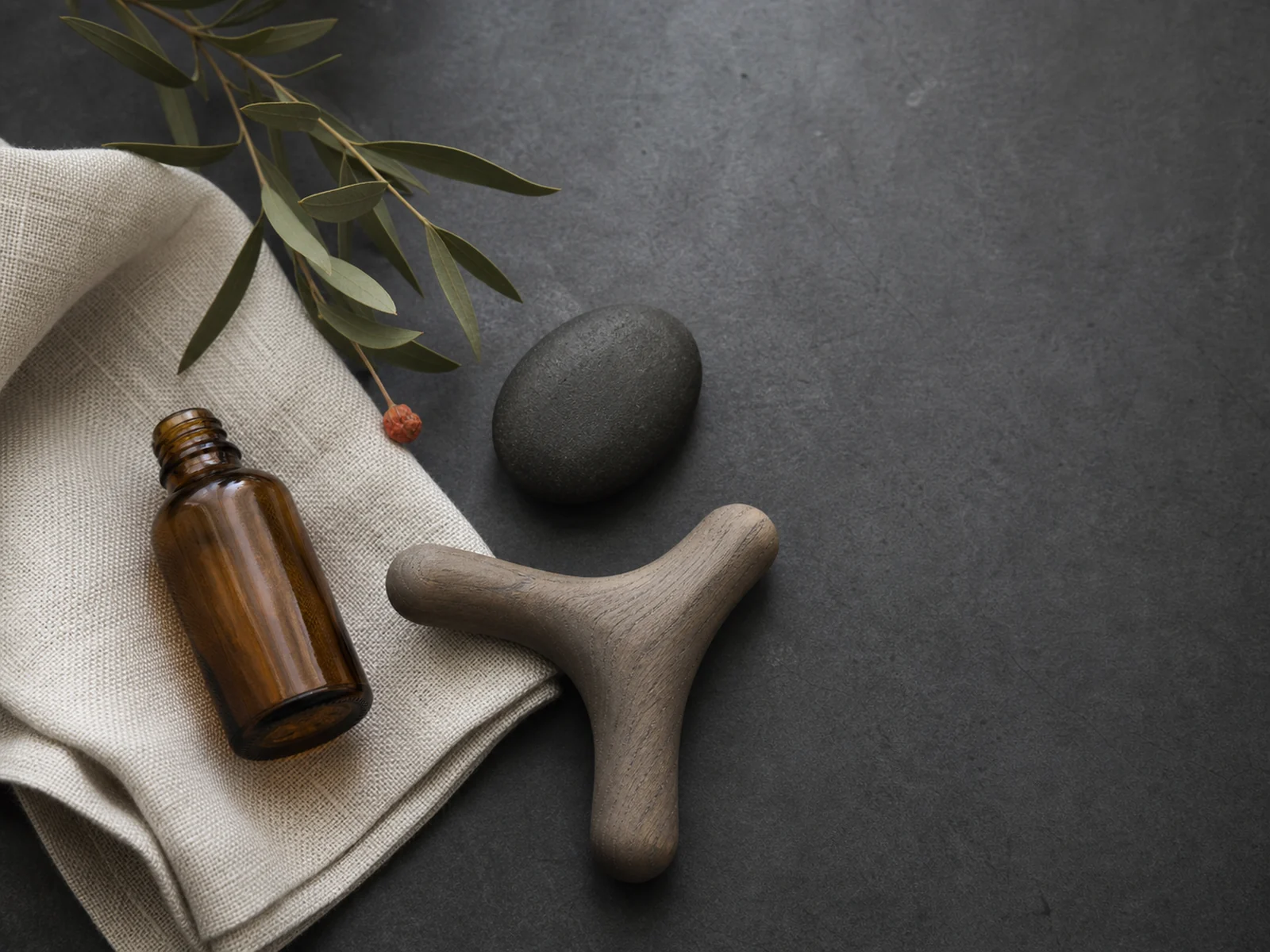 Massage oils, folded linen and treatment tools